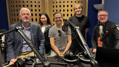Group-shot-with-Adam-in-studio-2-IMG-5340_cropped-960x540.jpg