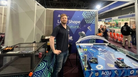 Patrick-Faulkner-with-robotic-football-game-Firefly-Upscaler-4x-scale.jpg
