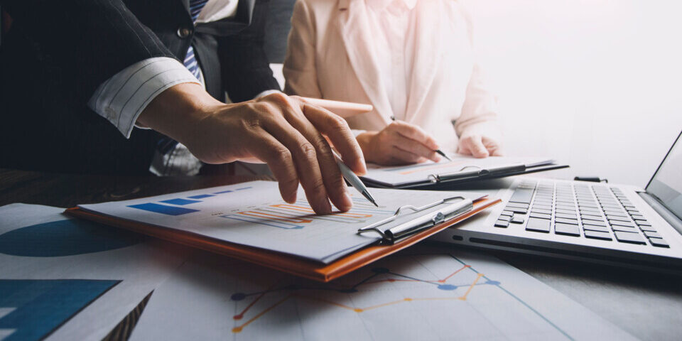 Businessman using tablet analyzing sales data and economic growth graph chart. Business strategy. Abstract icon. Digital marketing.