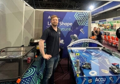 Patrick-Faulkner-with-robotic-football-game-Firefly-Upscaler-4x-scale.jpg